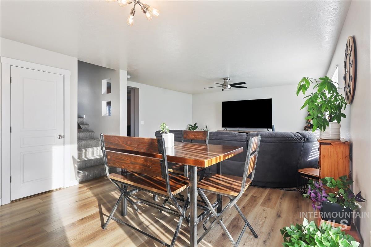 Dining room featuring light wood-type flooring and ceiling fan