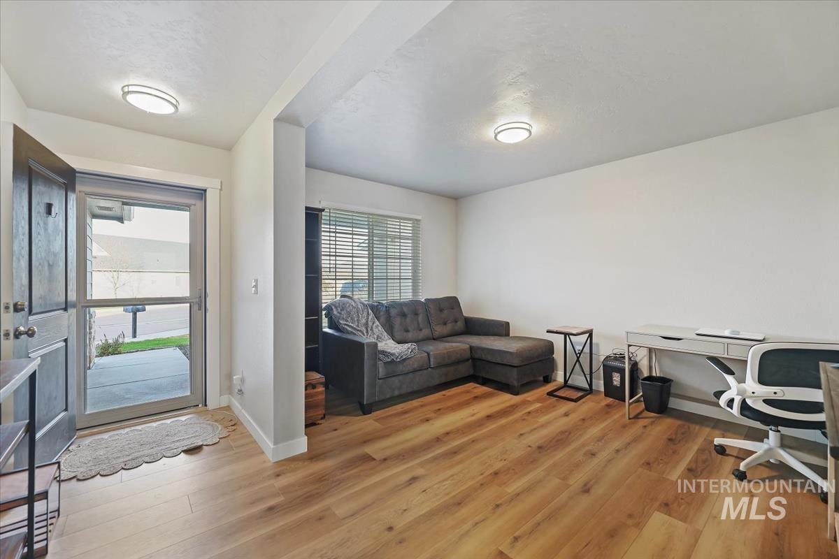Office area with plenty of natural light and light wood finished floors