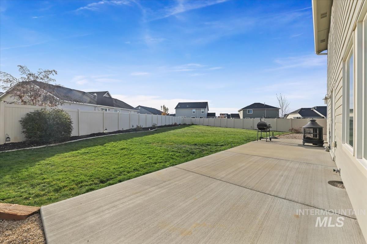 Deck with a patio, a fenced backyard, and area for grilling