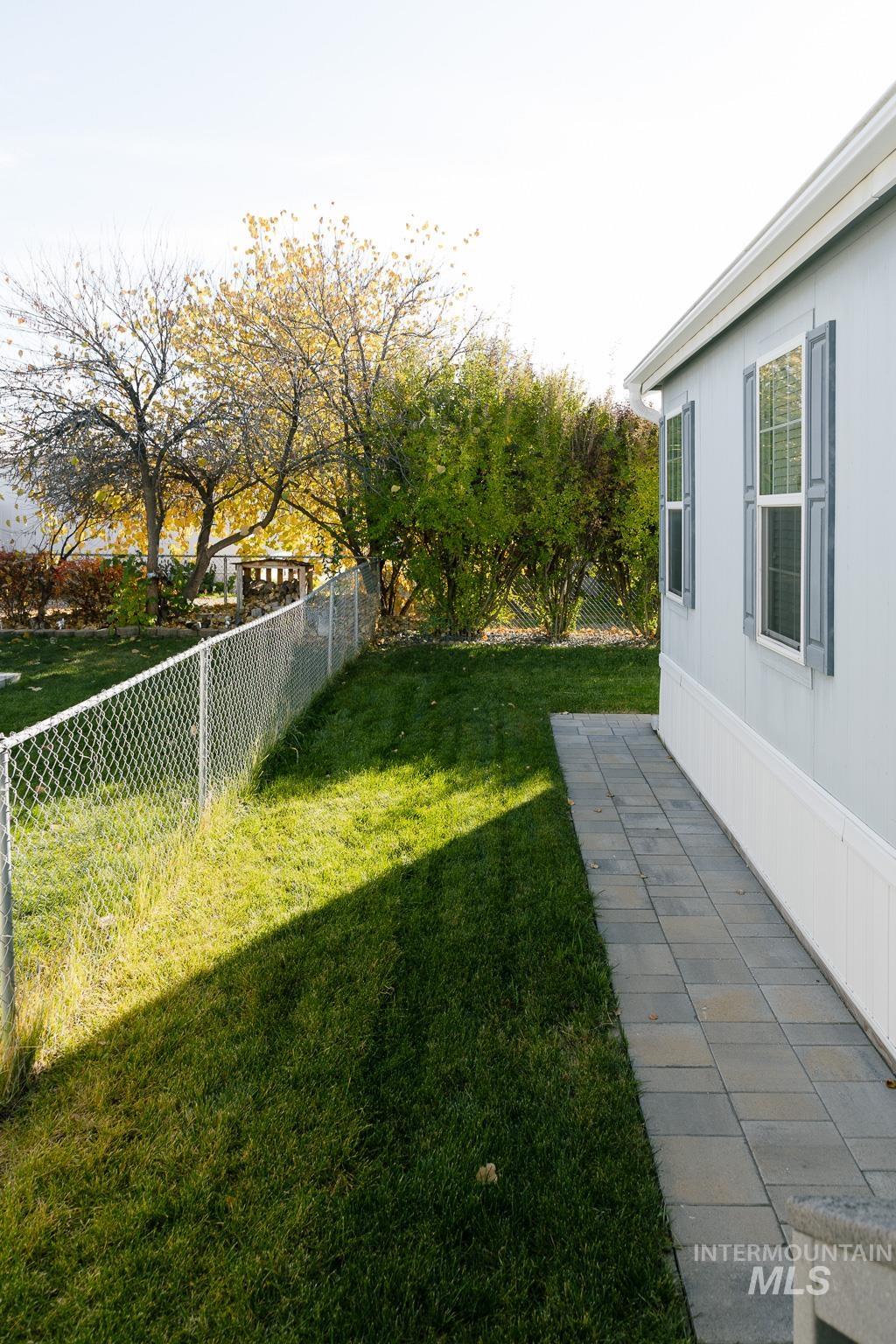 View of fenced backyard