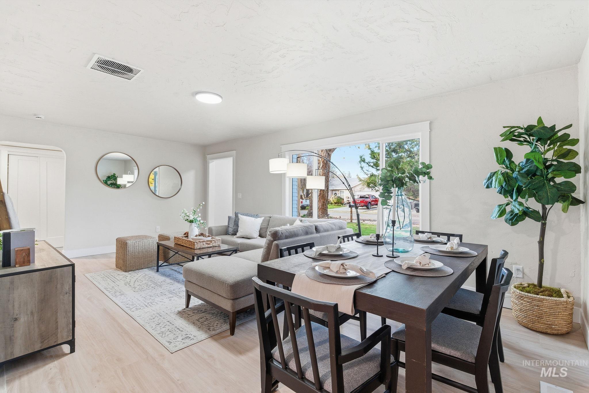 Dining room featuring light wood-style floors and baseboards