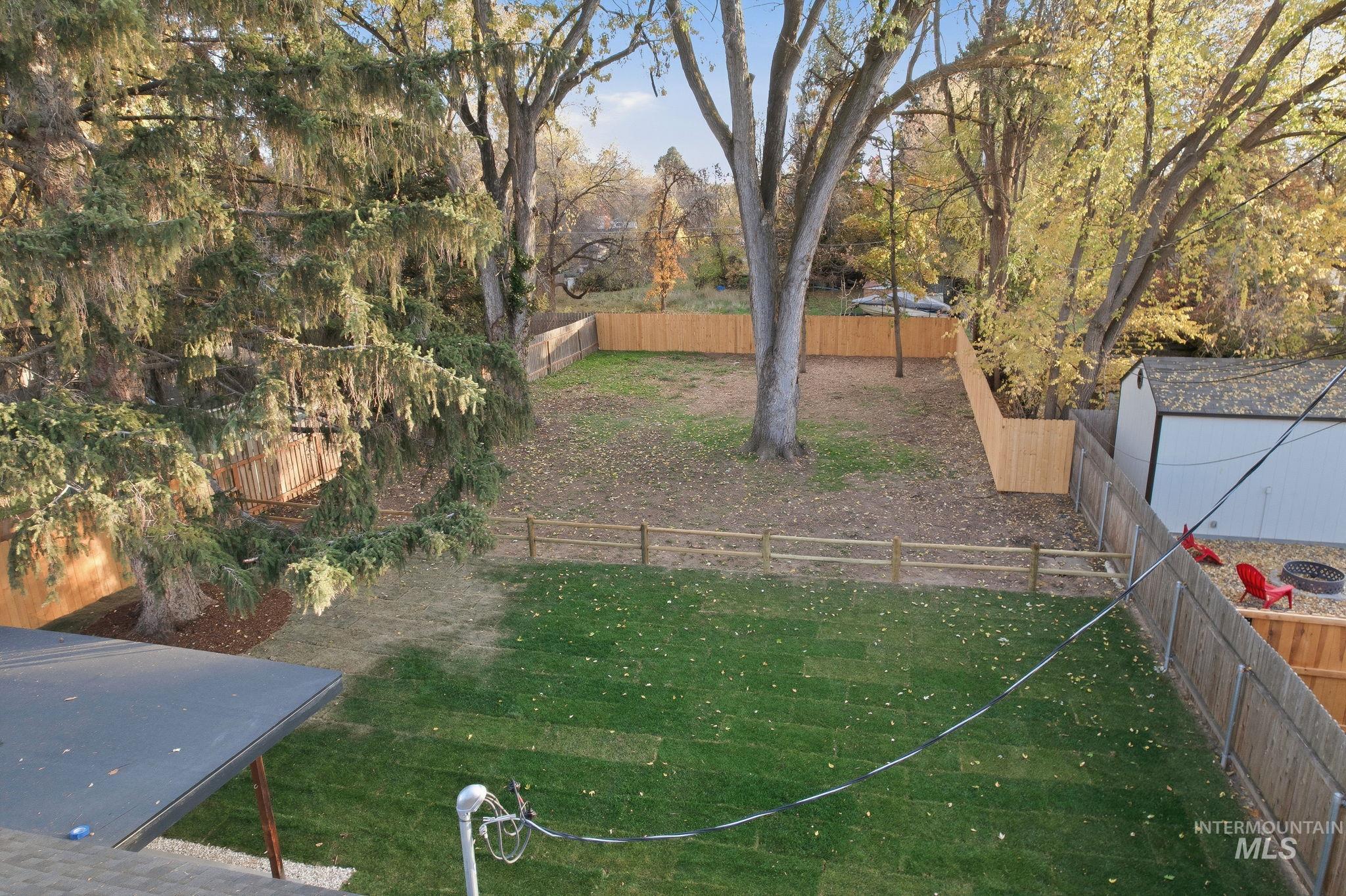 View of fenced backyard