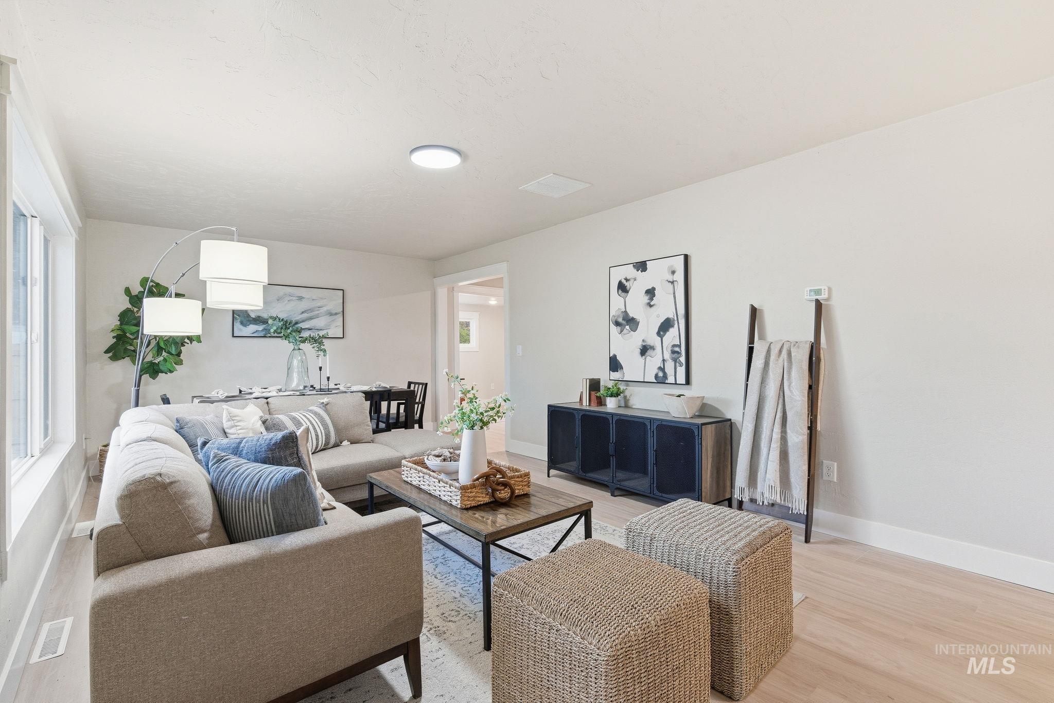Living room featuring wood finished floors and baseboards