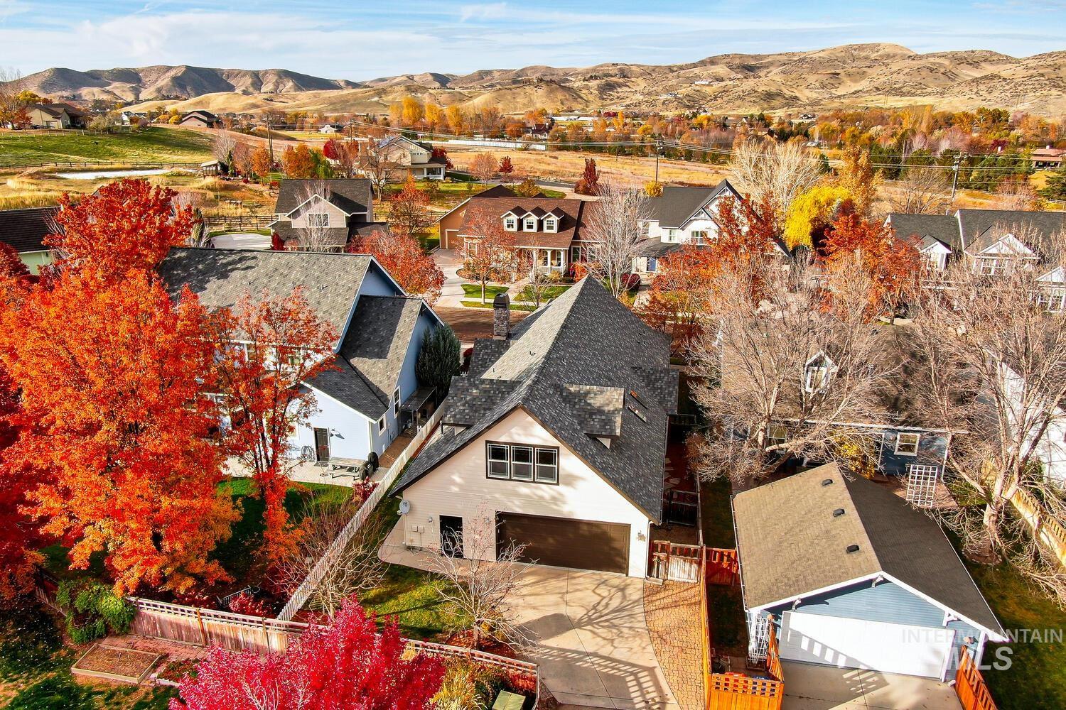 Aerial view of residential area featuring a mountain backdrop