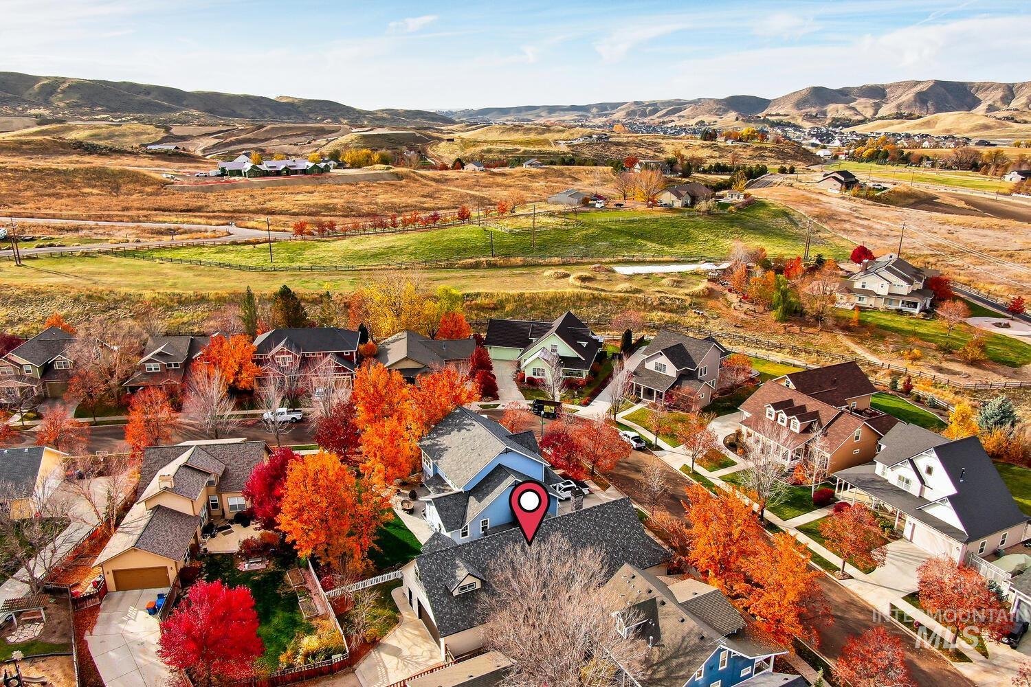 Aerial view of residential area featuring mountains