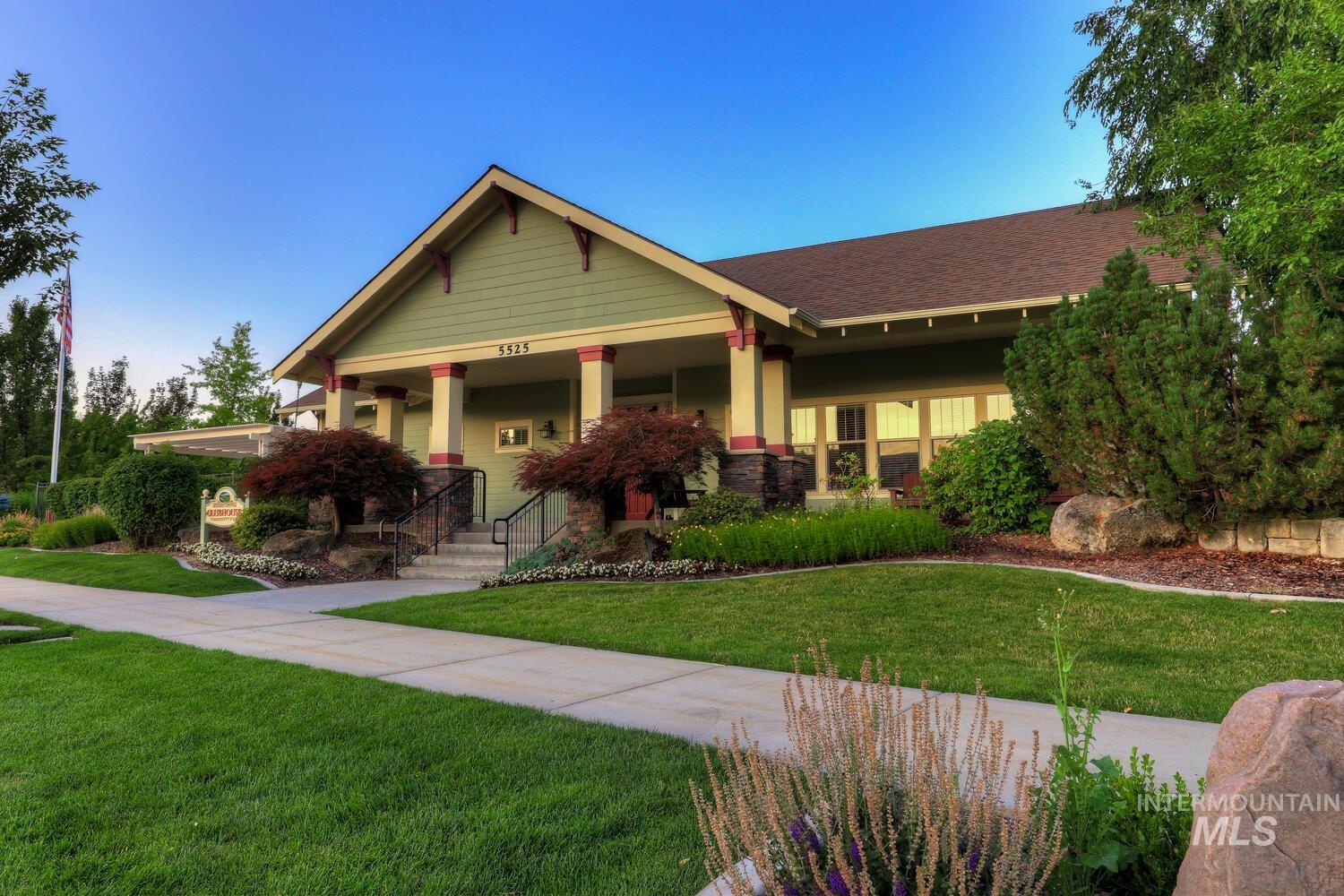 Craftsman house featuring a front yard, covered porch, and a shingled roof