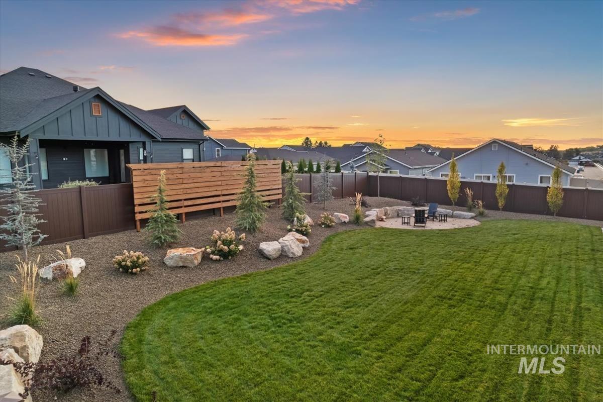 Fenced backyard featuring a patio