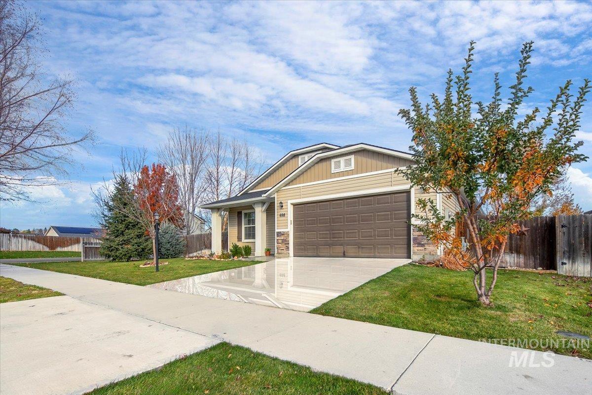 Craftsman-style home with driveway and an attached garage