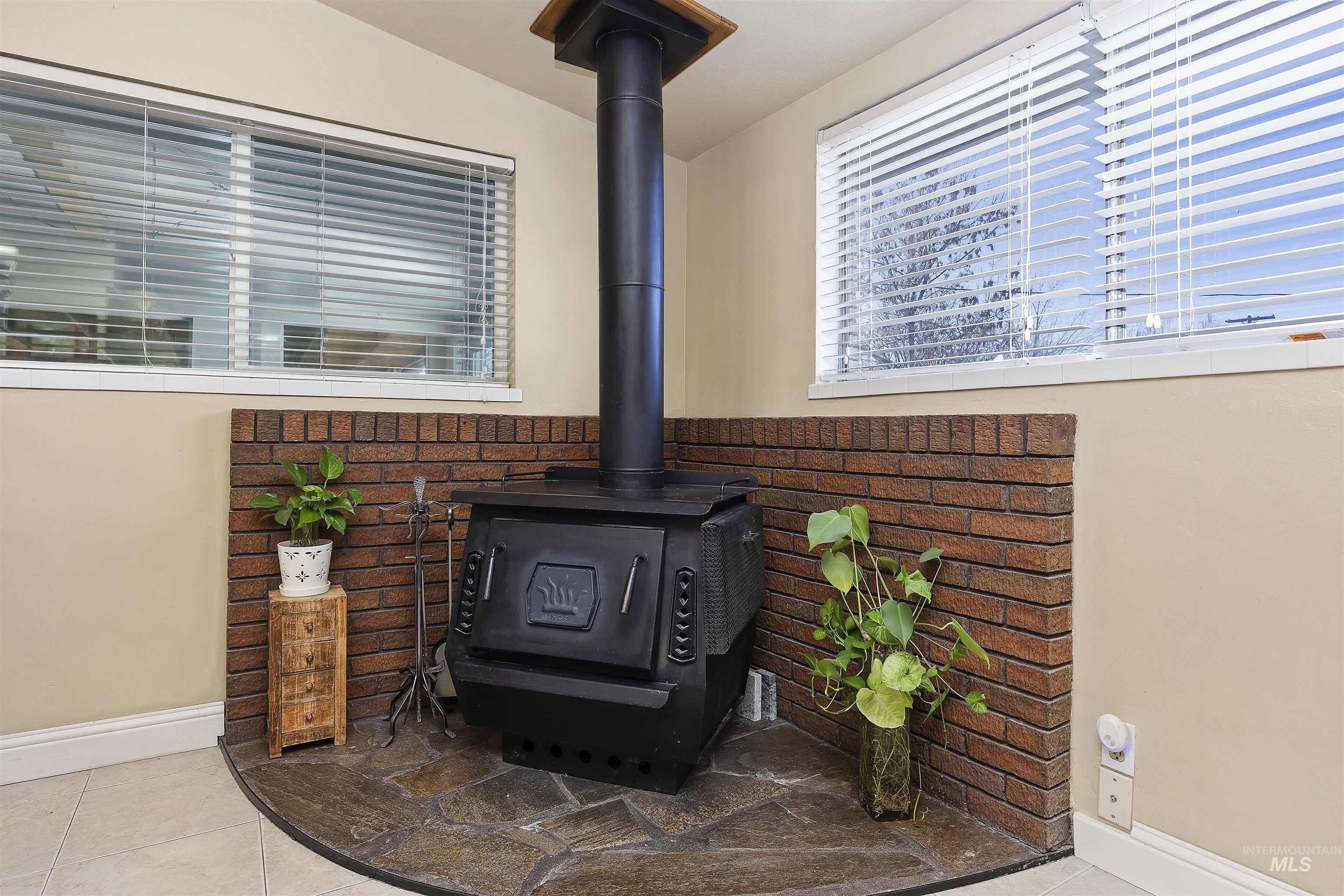 Detailed view of a wood stove and baseboards