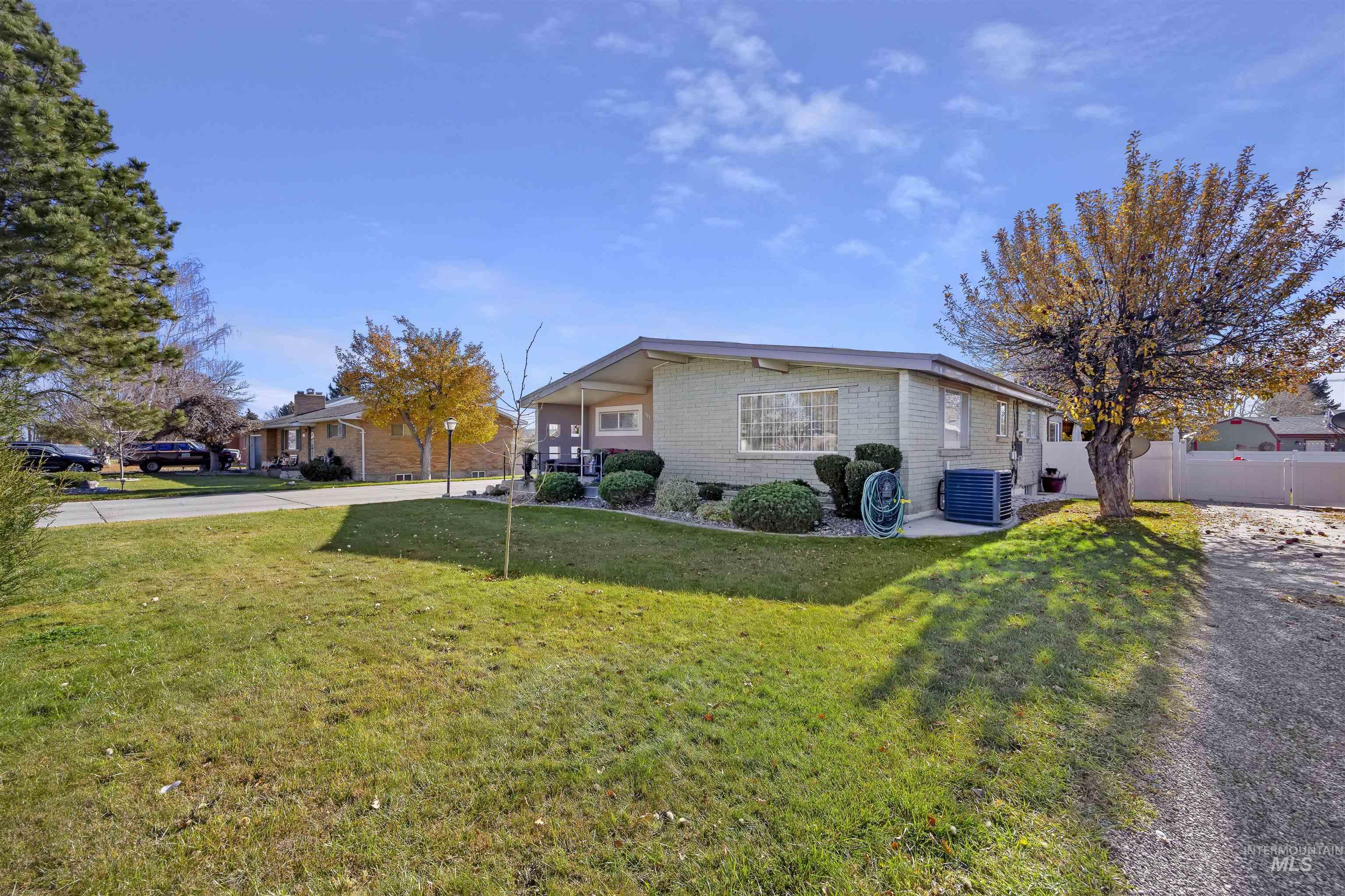 View of home's exterior featuring a central AC unit and brick siding