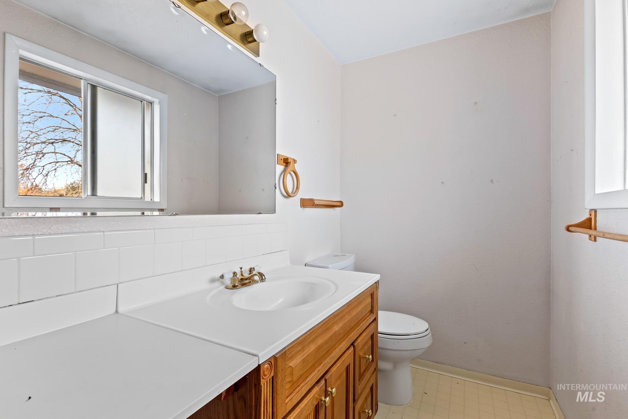 Bathroom with plenty of natural light and vanity