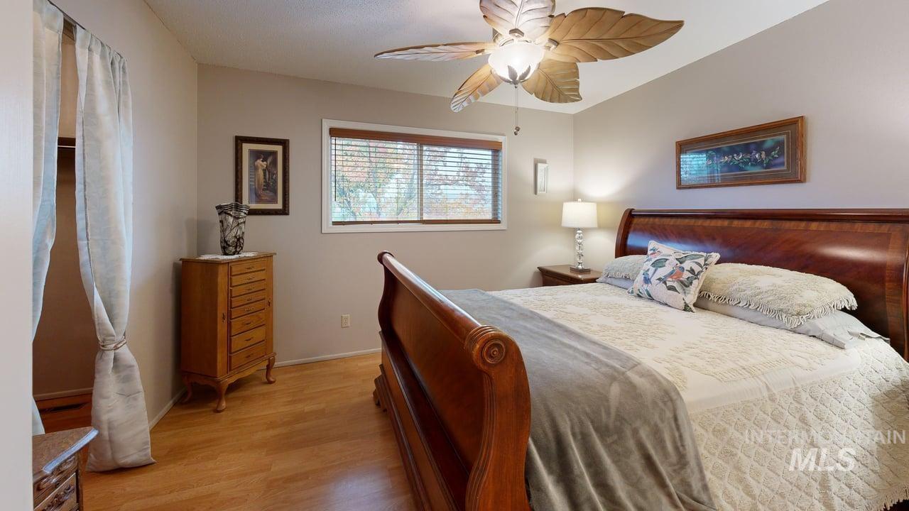 Bedroom featuring light wood finished floors and a ceiling fan