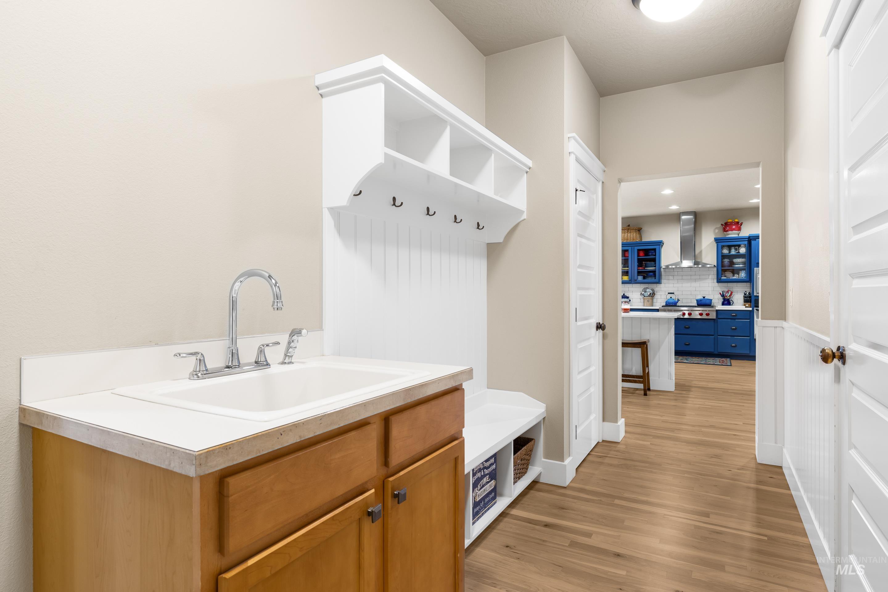 Mudroom with a sink and light wood-type flooring
