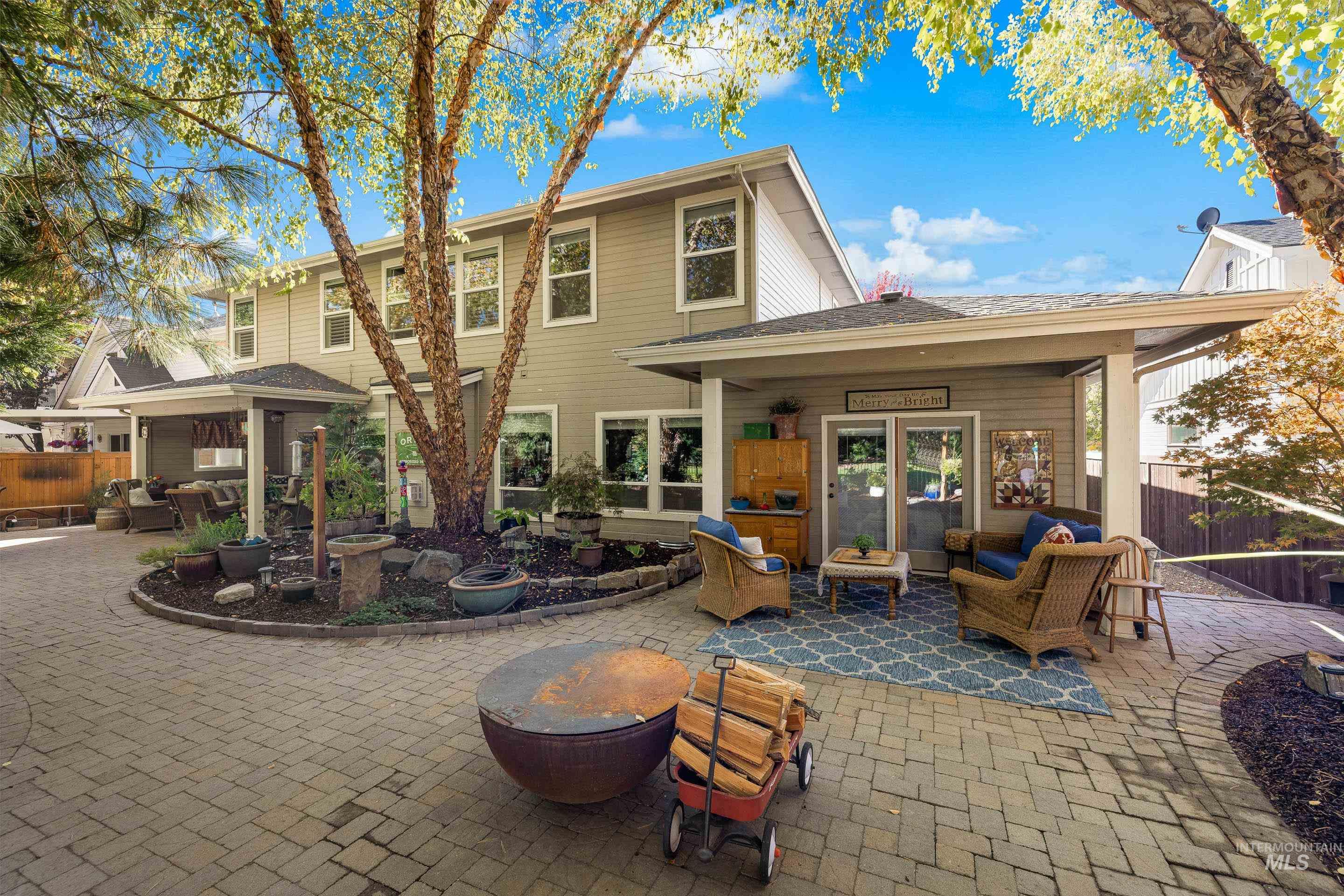 Rear view of house with an outdoor hangout area and a patio