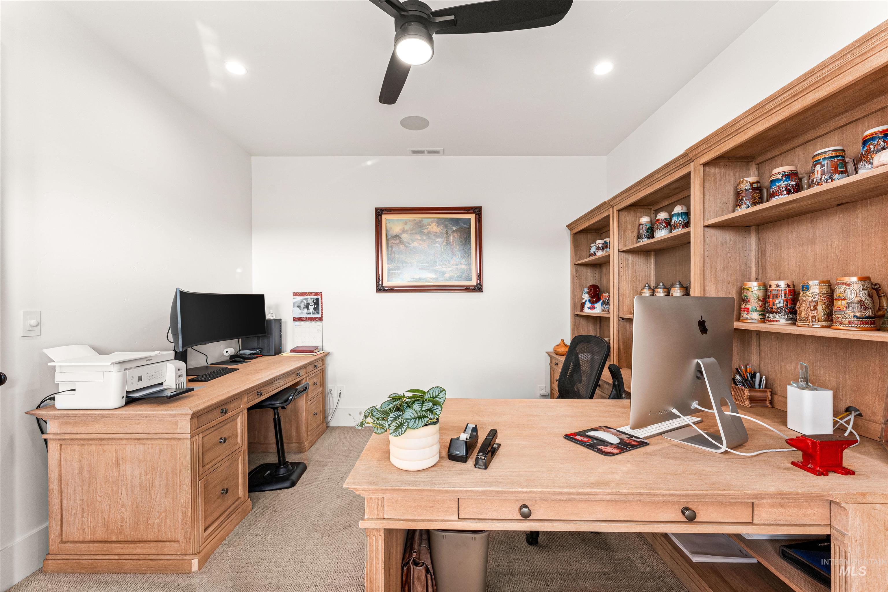 Office area with light colored carpet, ceiling fan, and recessed lighting