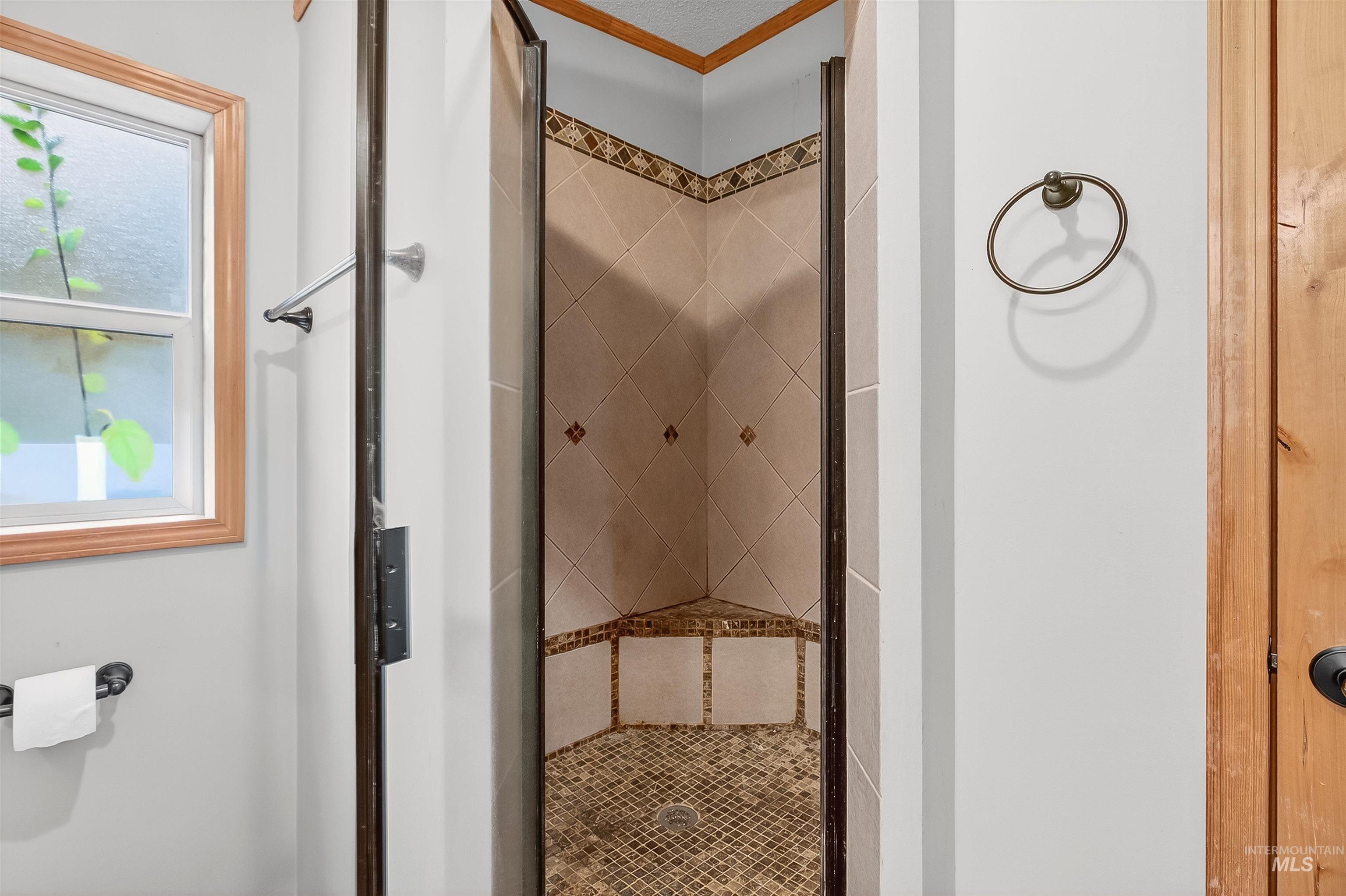 Full bathroom featuring a stall shower