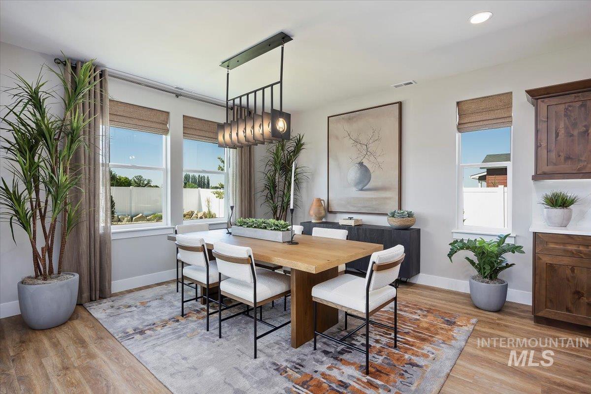 Dining room featuring baseboards and light wood finished floors