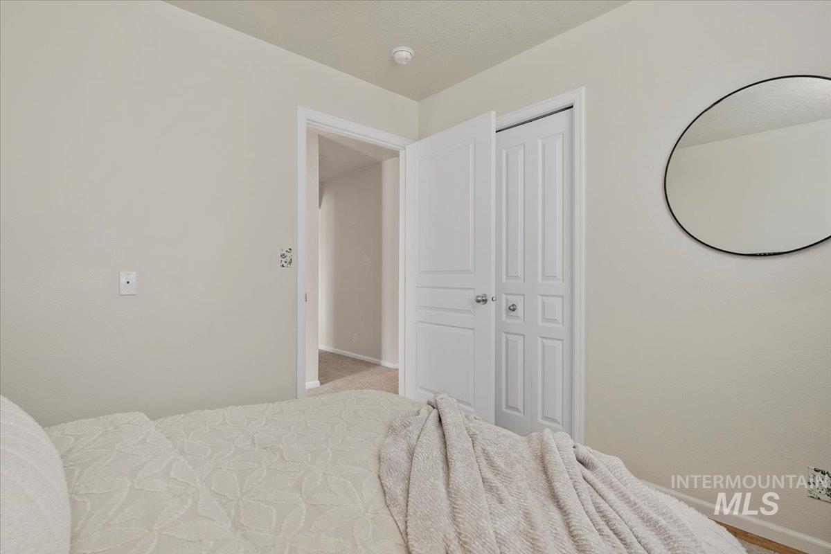 Carpeted bedroom with baseboards