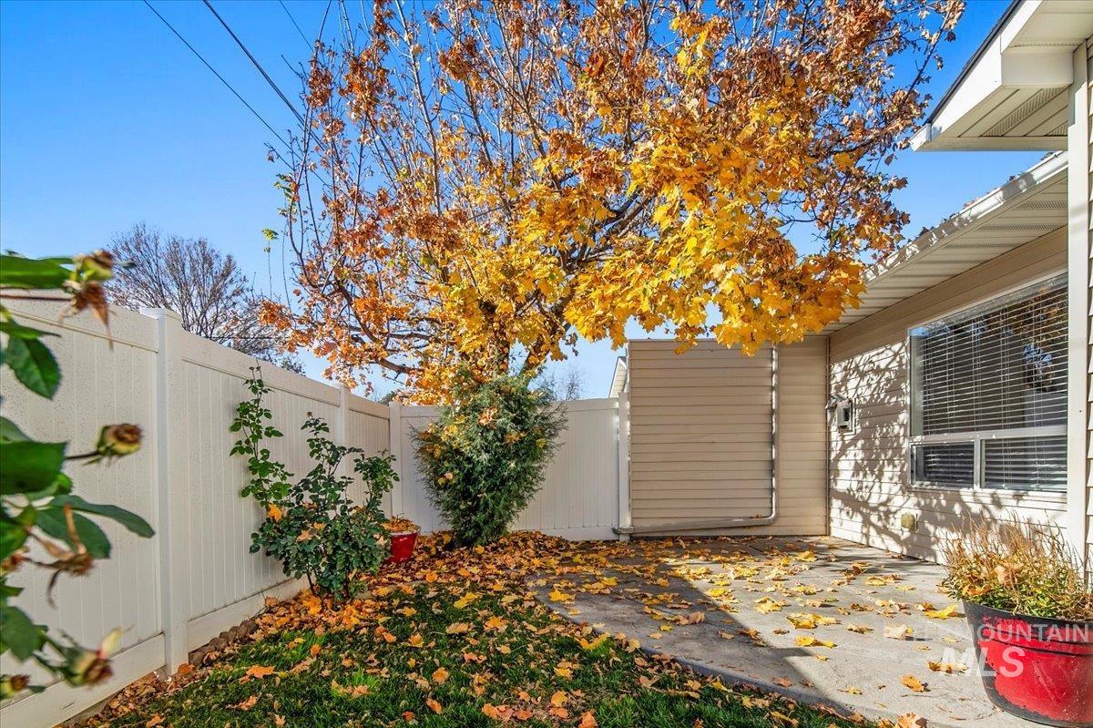 Fenced backyard with a patio area