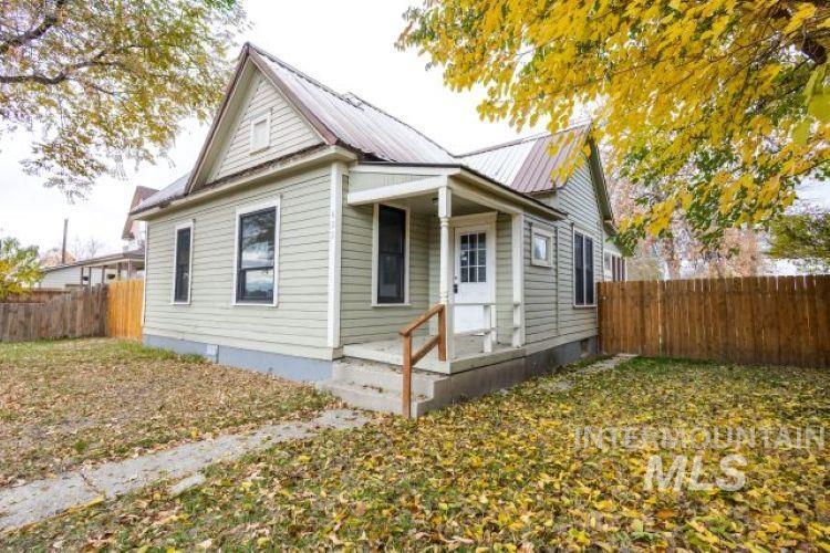Back of house with a metal roof