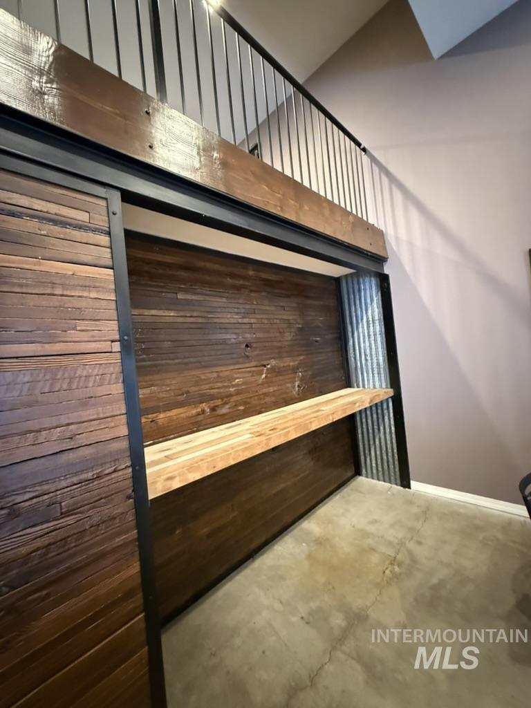 Detailed view of concrete flooring and baseboards