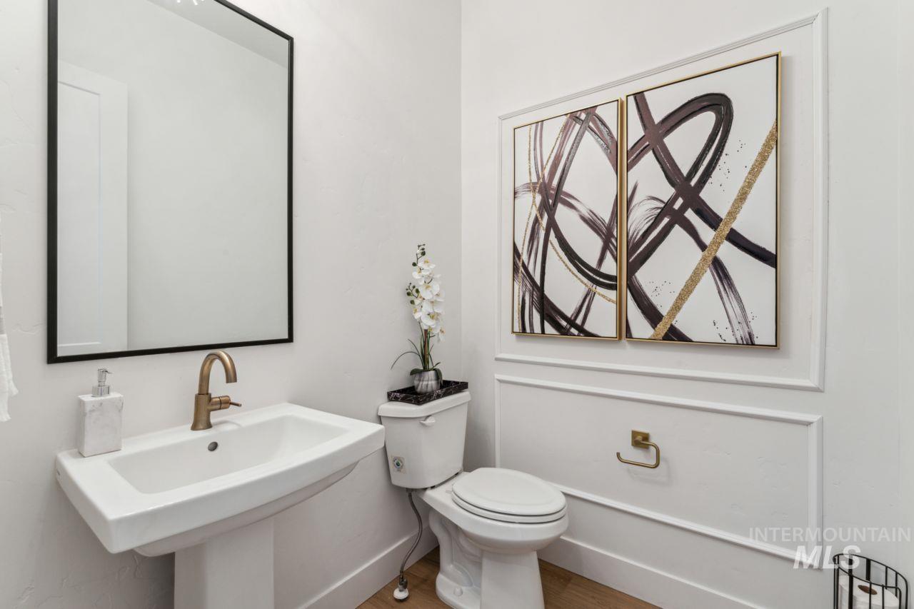 Bathroom featuring toilet and wood finished floors