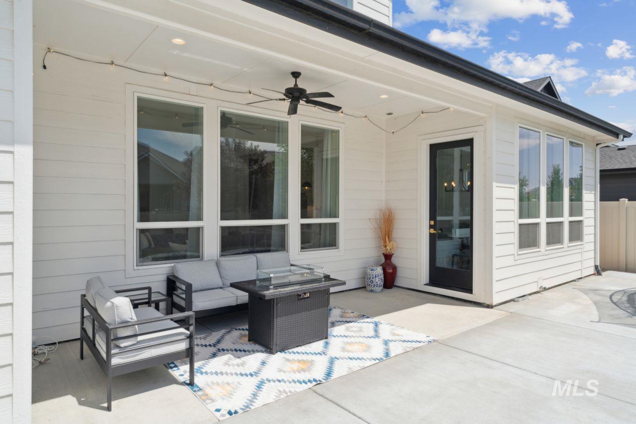 View of patio / terrace with ceiling fan and an outdoor living space