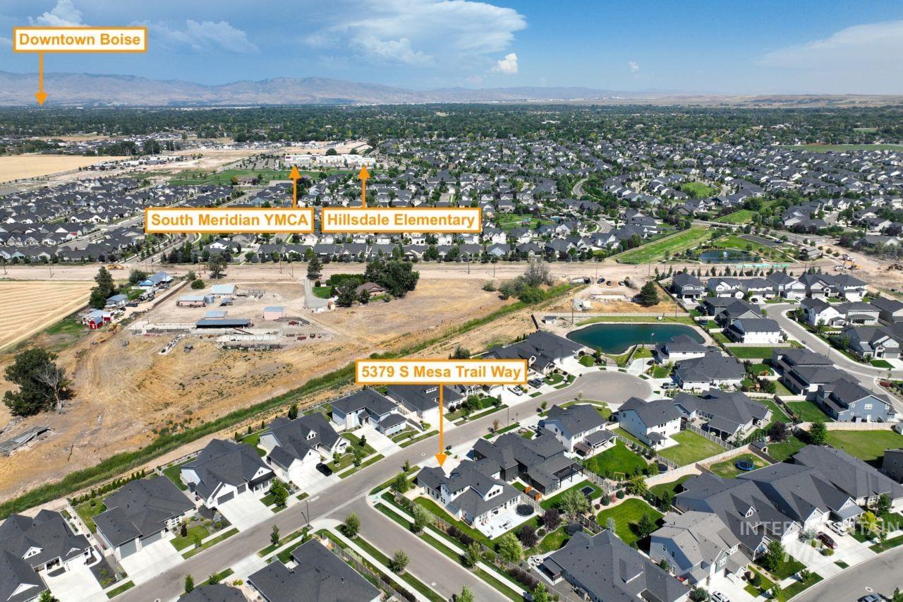 Aerial view of property's location featuring nearby suburban area
