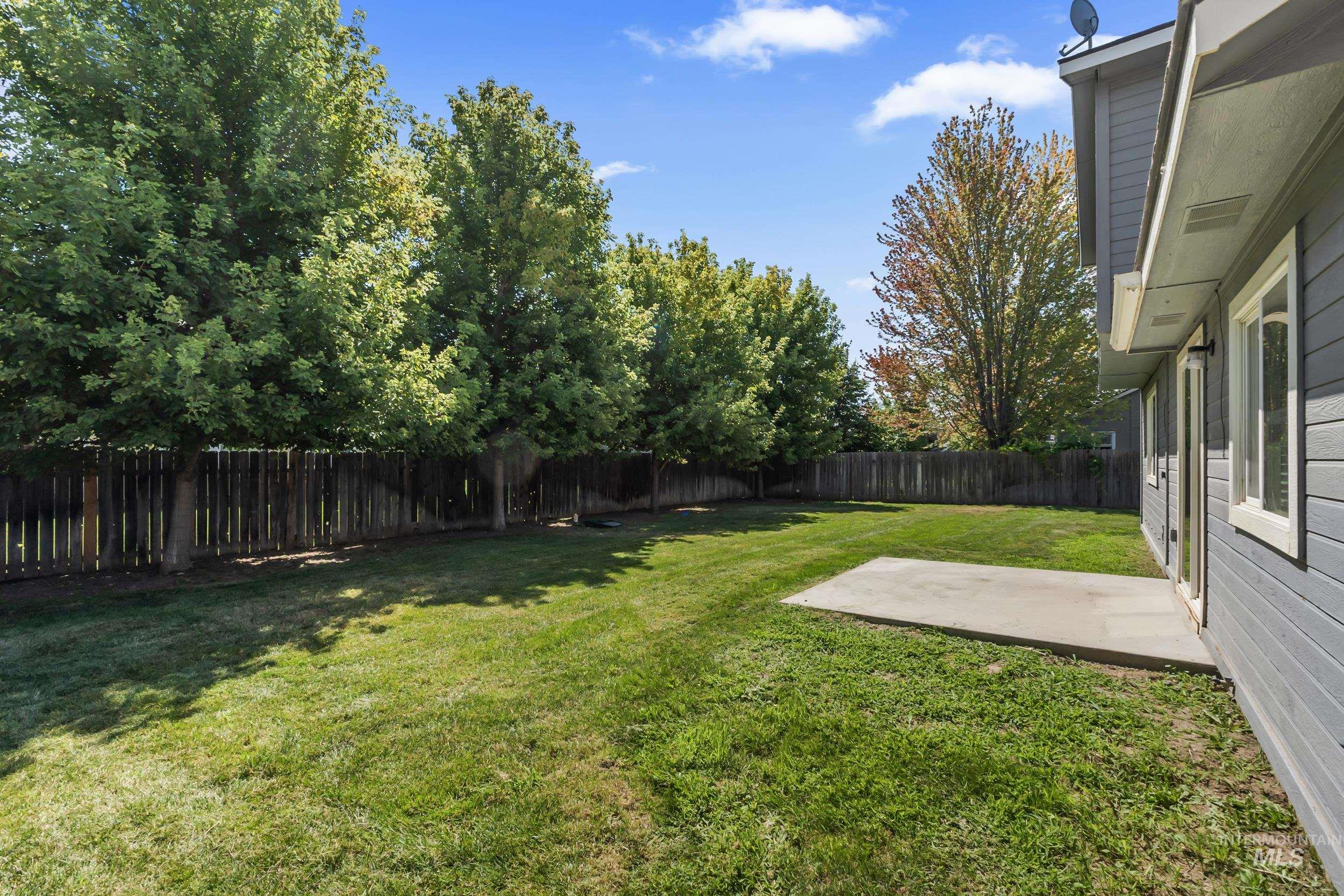 Fenced backyard featuring a patio area