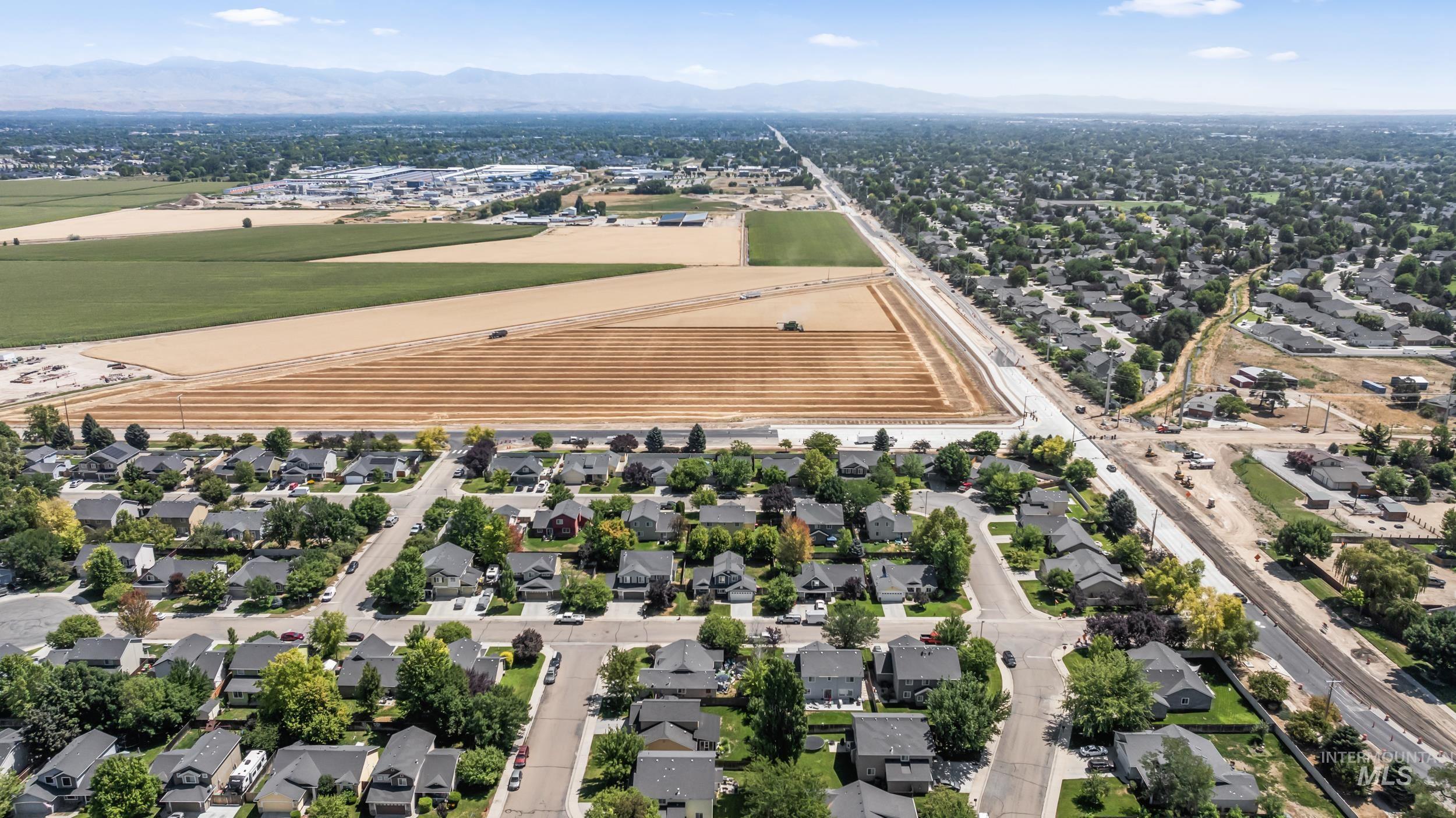 Aerial view of residential area with a mountain backdrop