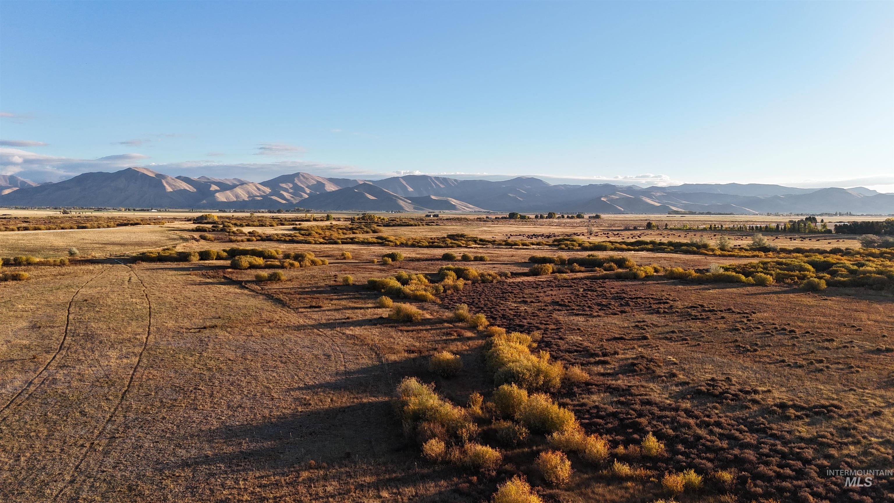 View of mountain background featuring rural landscape