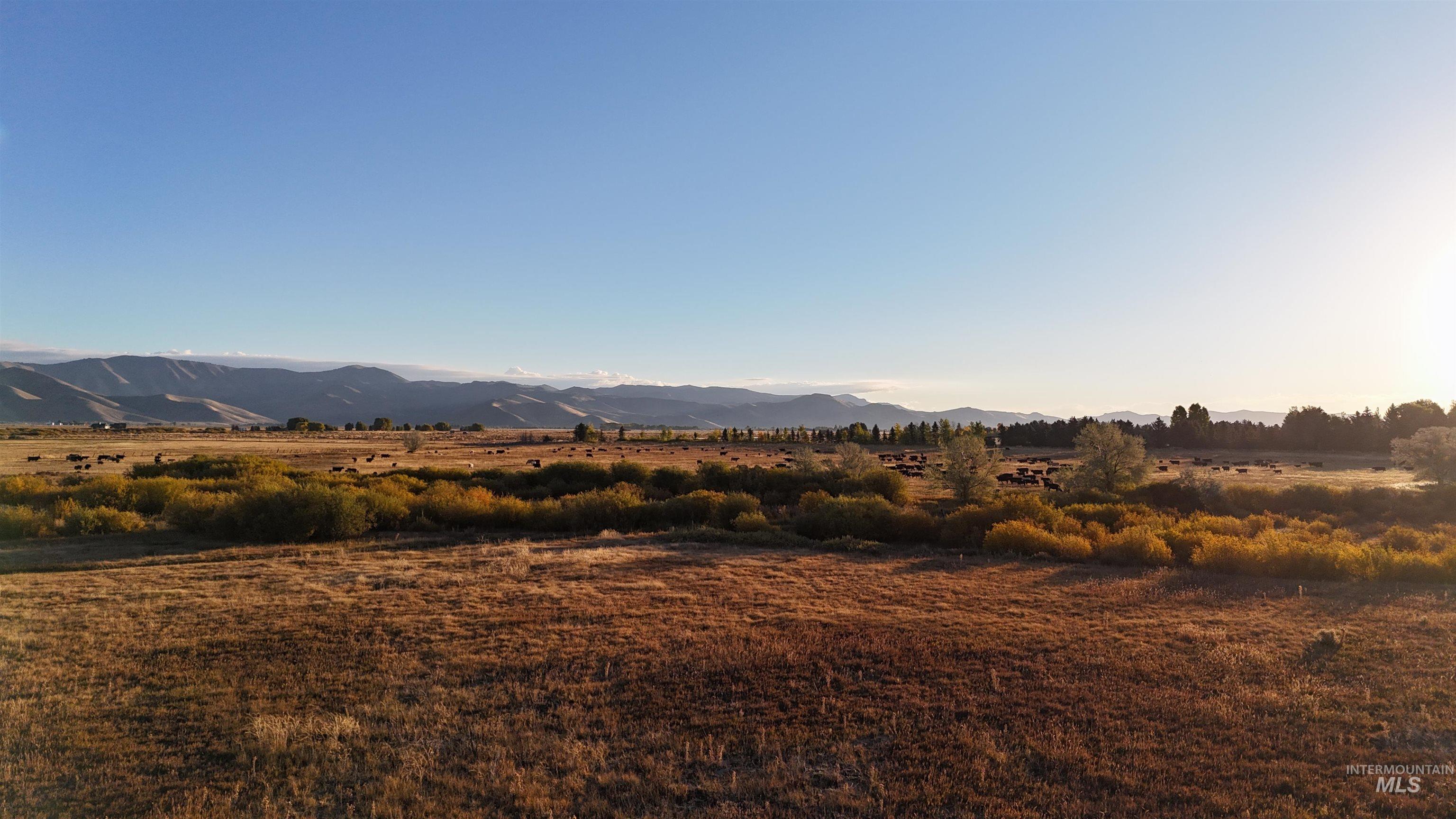 View of mountain background featuring rural landscape