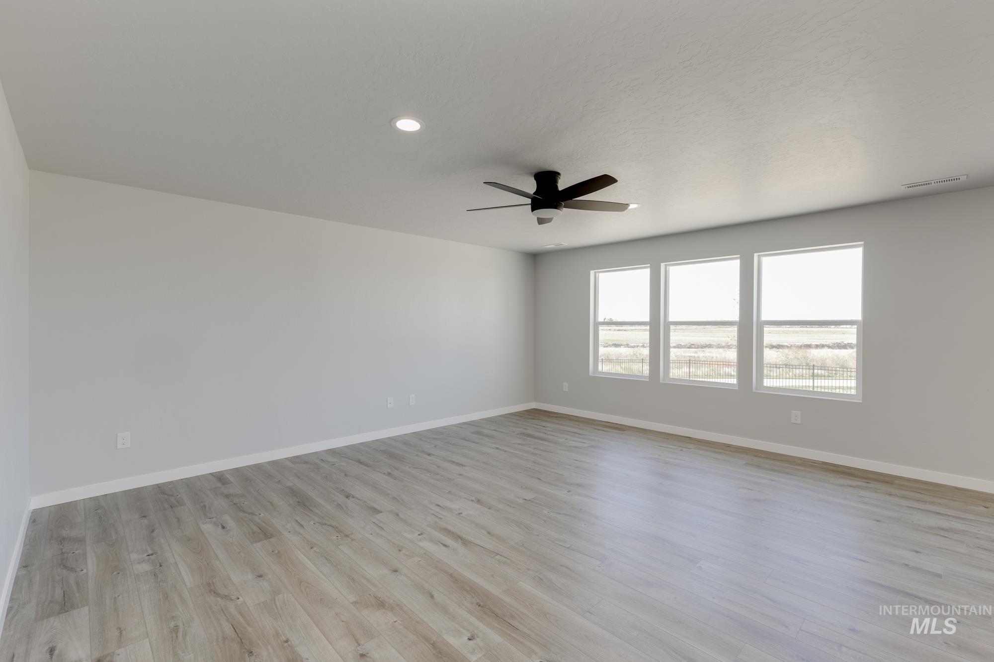 Spare room featuring light wood-style flooring, recessed lighting, and ceiling fan