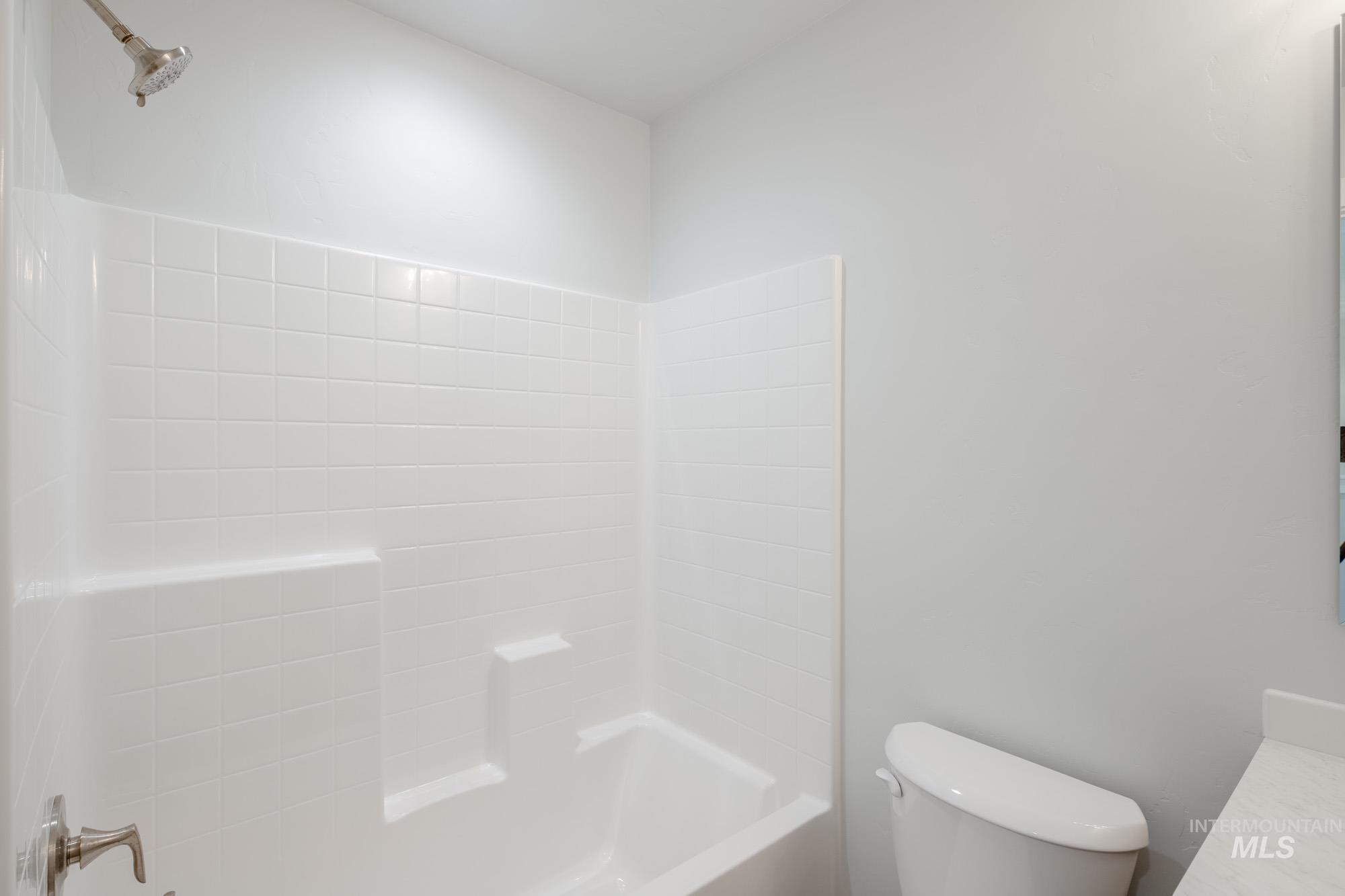 Bathroom with shower / tub combination and vanity