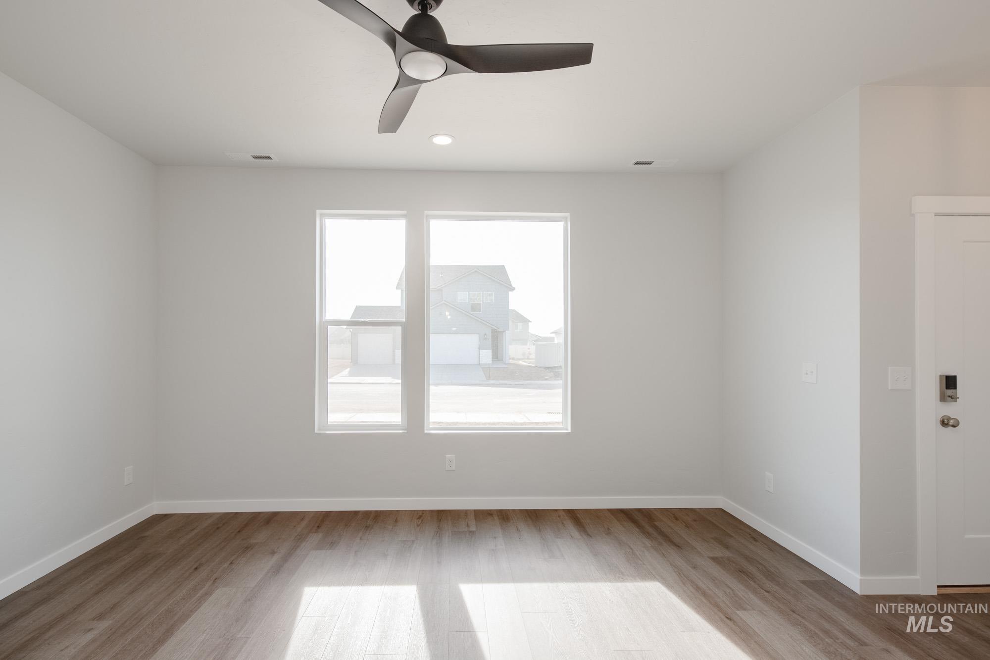Unfurnished room with light wood-style floors, ceiling fan, and recessed lighting