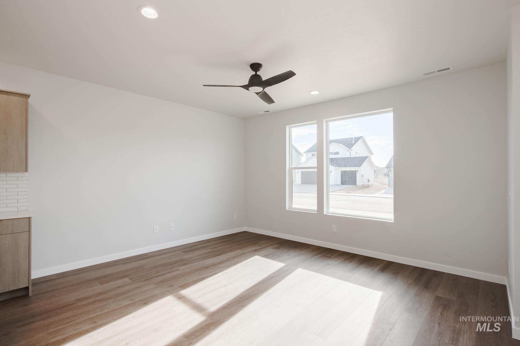 Empty room featuring recessed lighting, light wood-type flooring, and ceiling fan