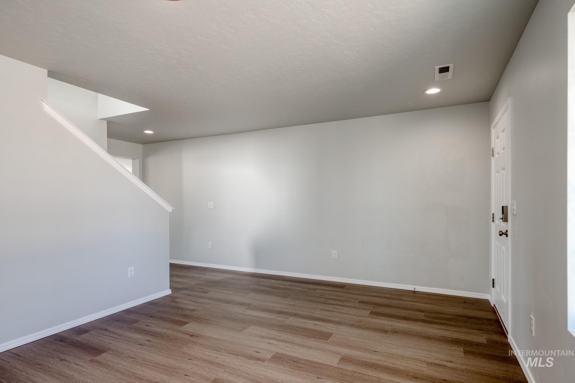 Basement featuring wood finished floors and recessed lighting