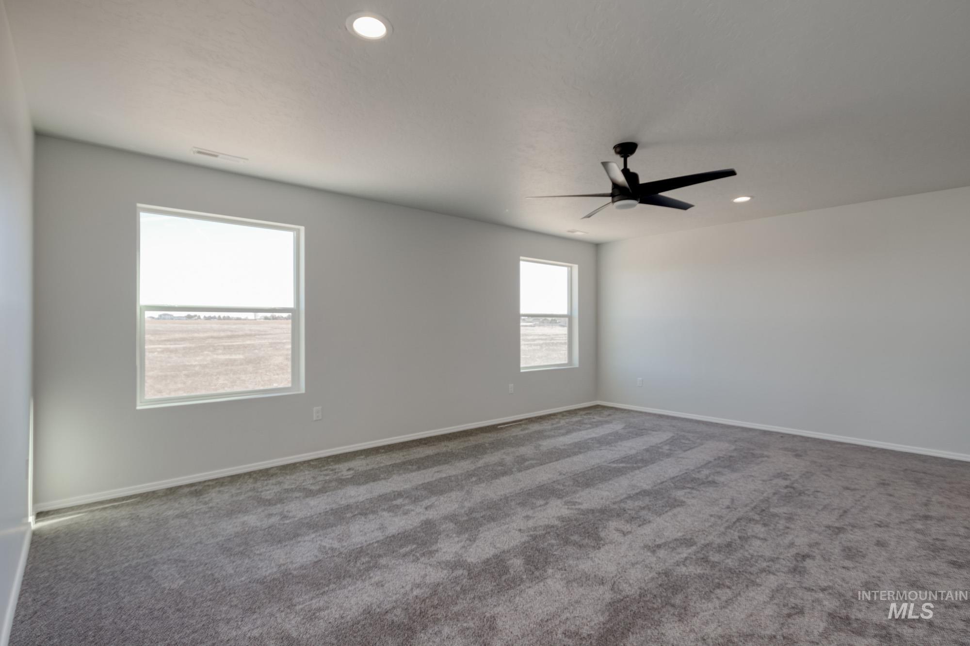 Spare room featuring carpet flooring, recessed lighting, and ceiling fan