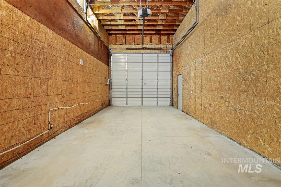 Garage featuring a garage door opener