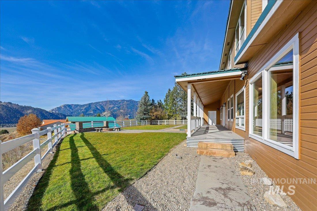 Fenced backyard with a mountain view