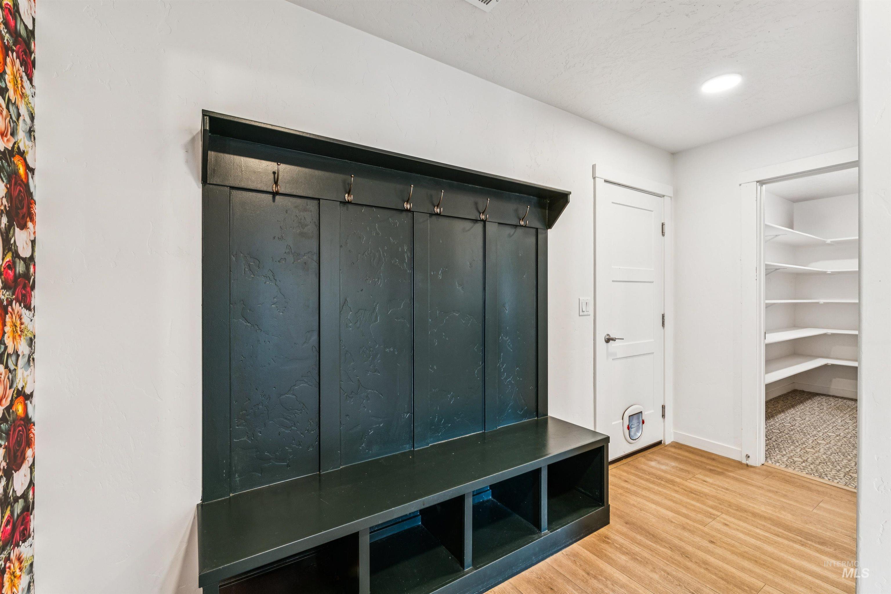Mudroom featuring light wood-style floors and recessed lighting