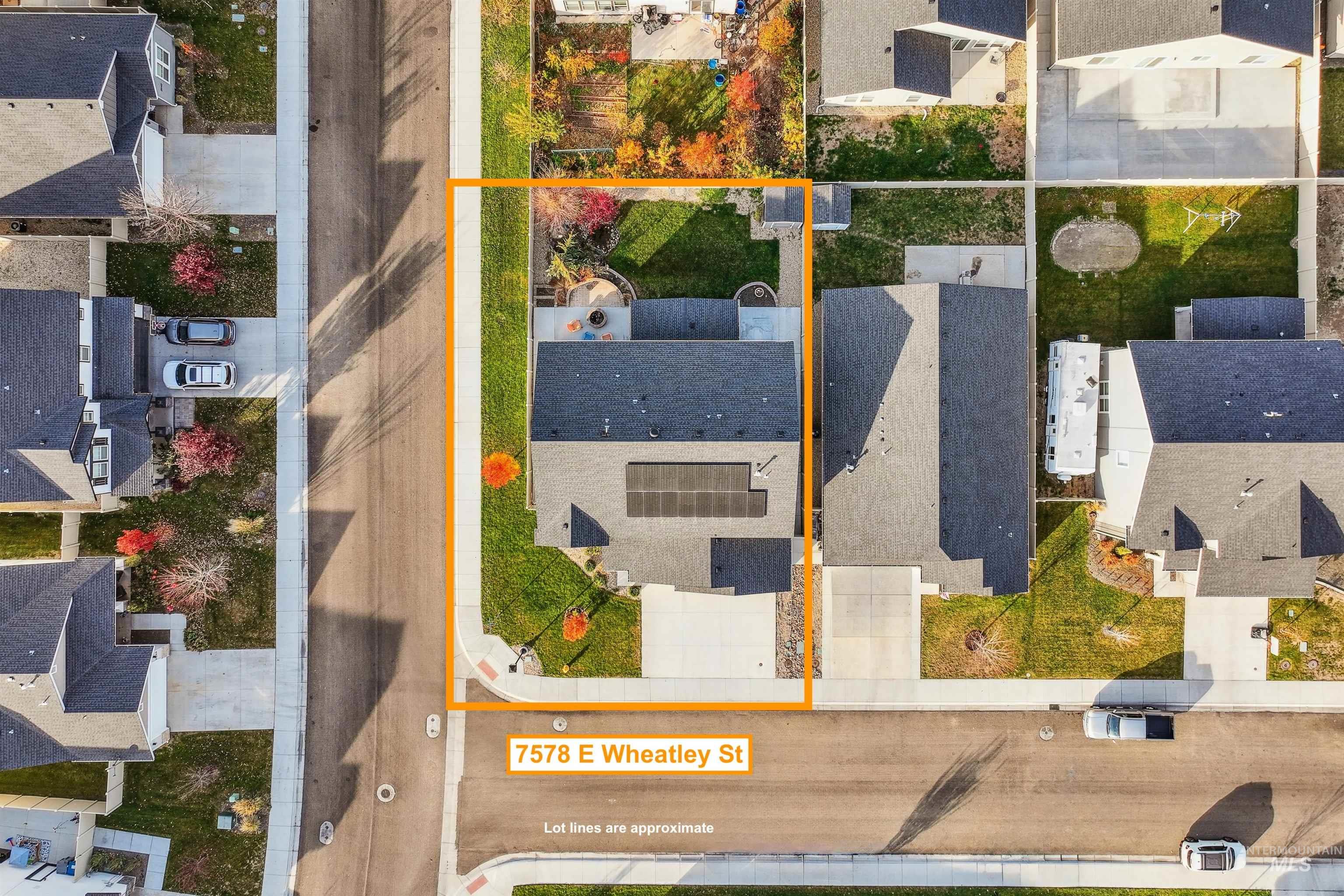 Aerial view of residential area with property boundaries highlighted
