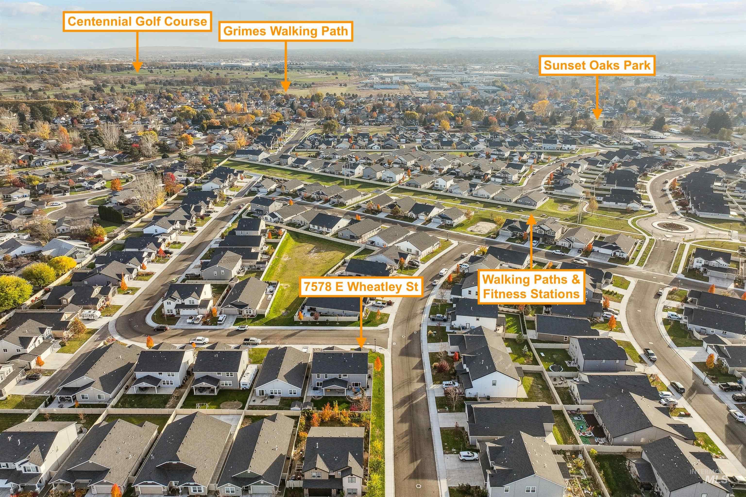 Aerial overview of property's location featuring nearby suburban area