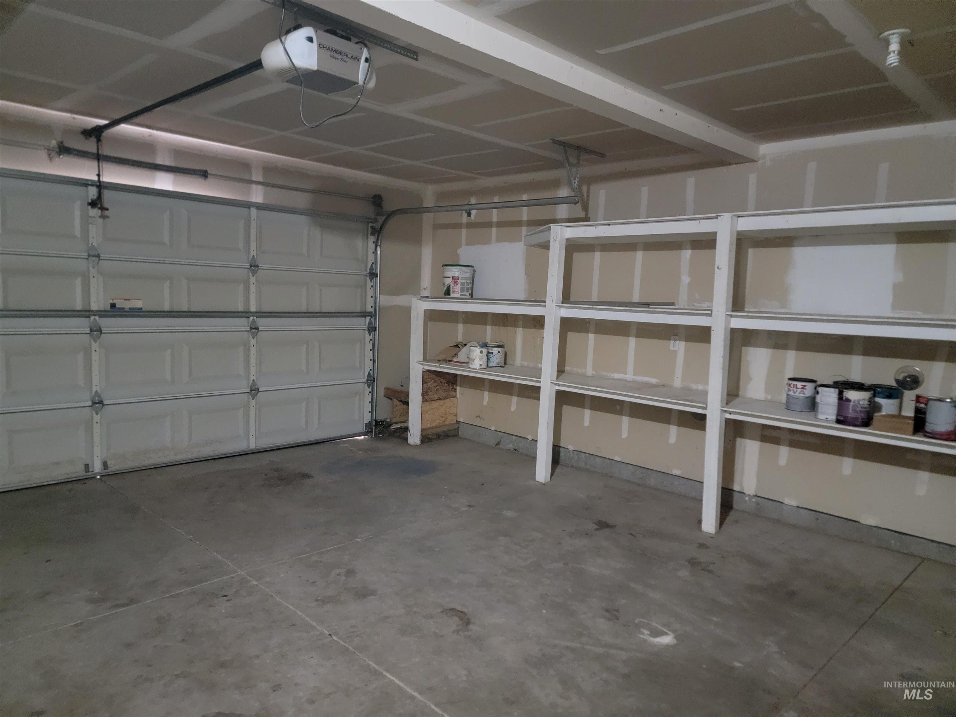 Garage featuring a garage door opener