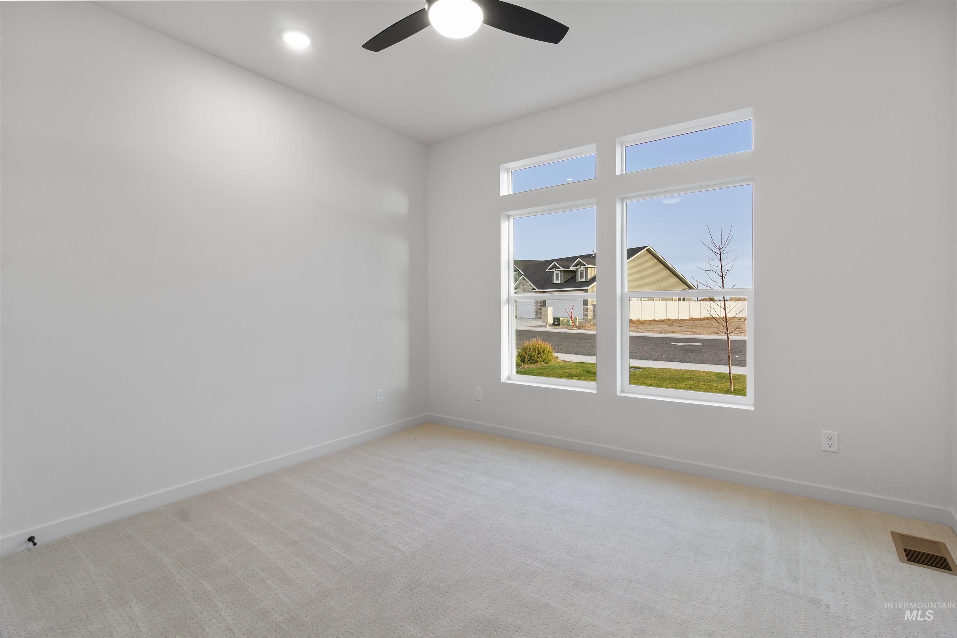 Unfurnished room featuring light carpet, recessed lighting, and ceiling fan