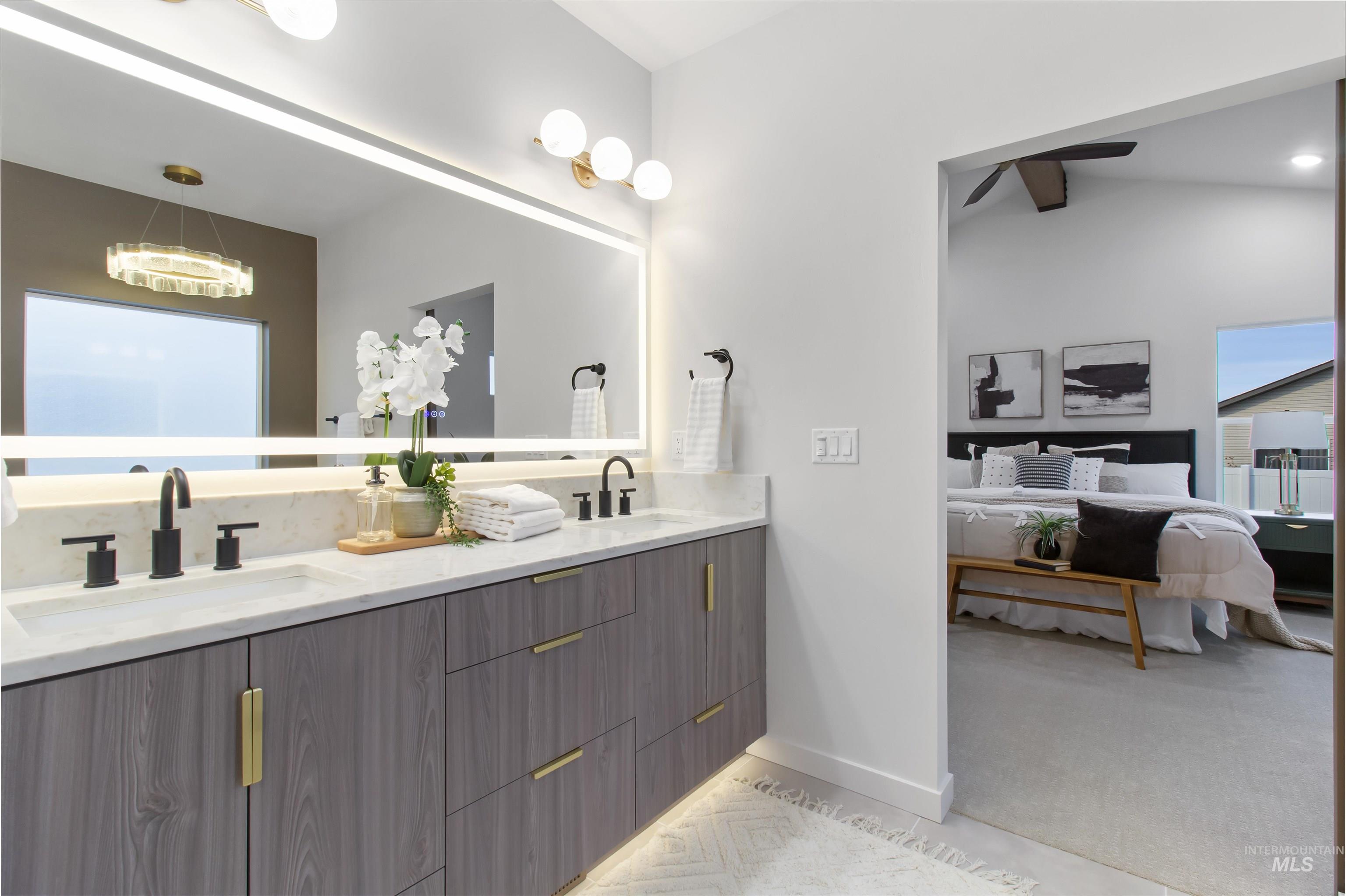 Bathroom with double vanity, ensuite bath, and light carpet
