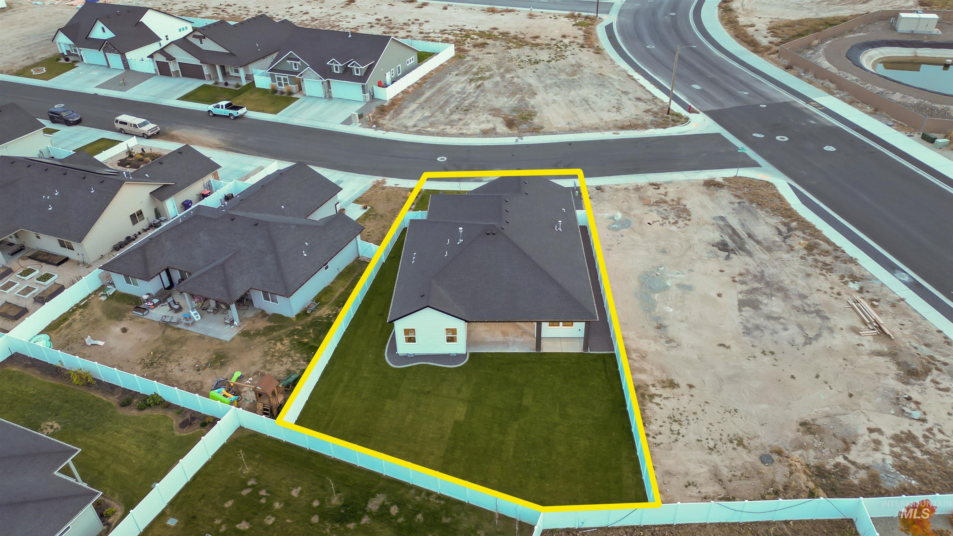 Aerial view of residential area with property parcel outlined