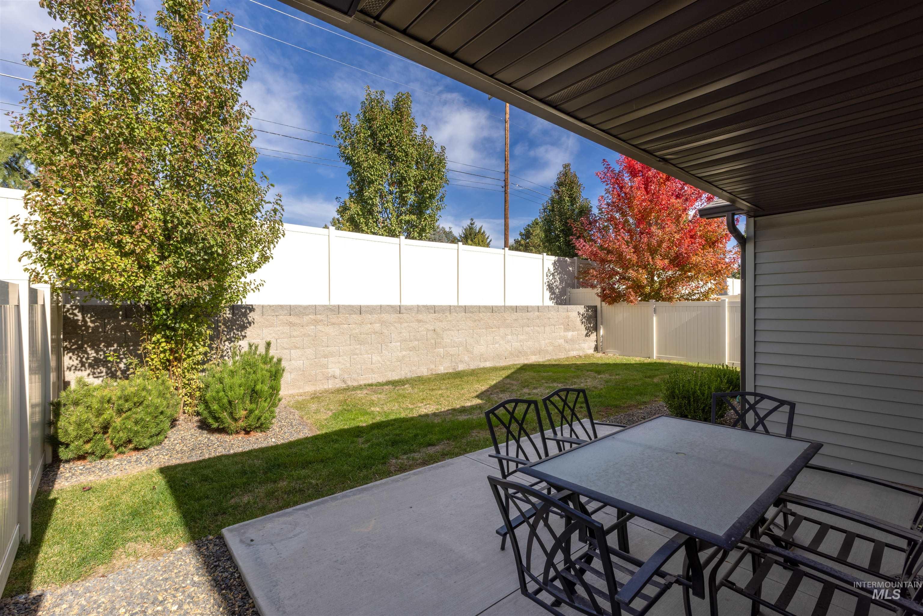 Fenced backyard featuring a patio area and outdoor dining area