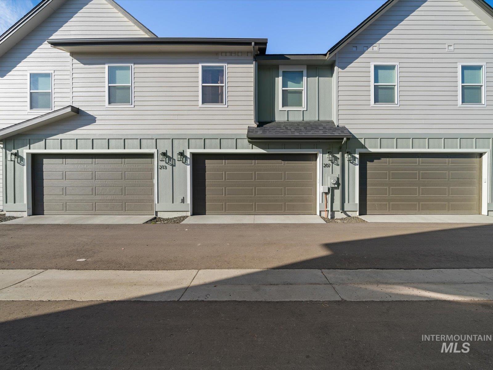 Traditional home with board and batten siding and a garage