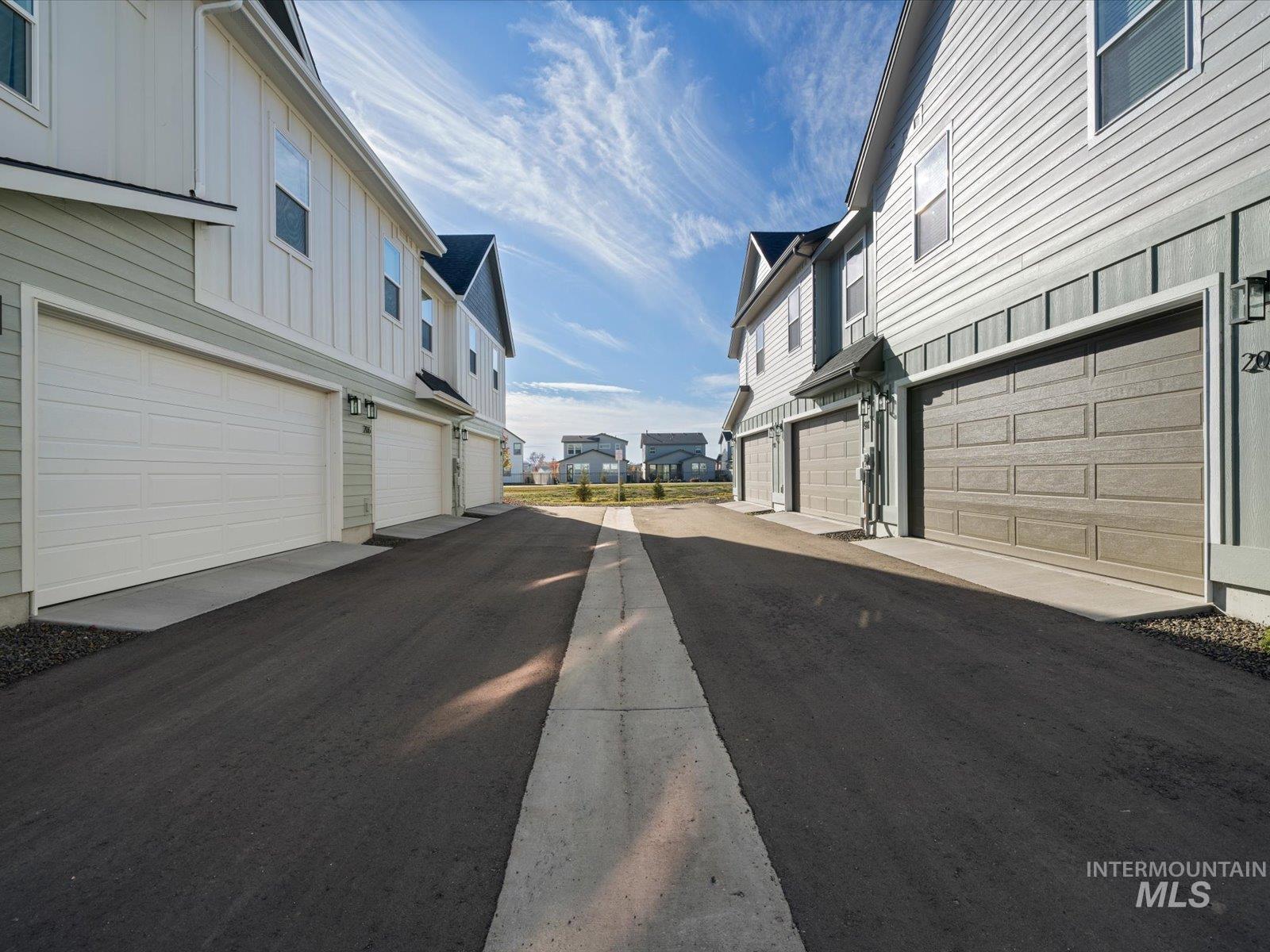 View of asphalt road with a residential view